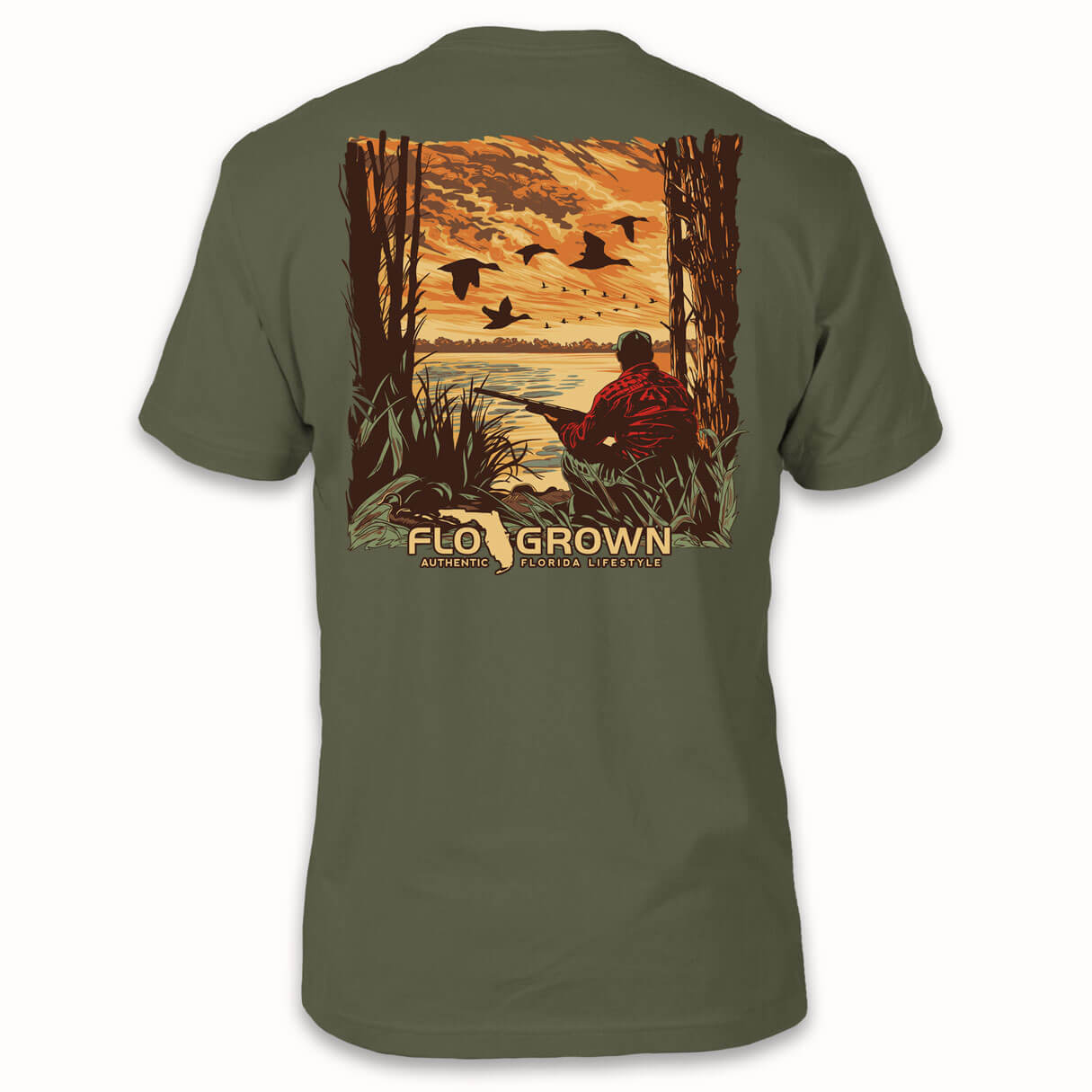 Green t-shirt with a hunter squatting with a rifle near flying ducks by the water on the back