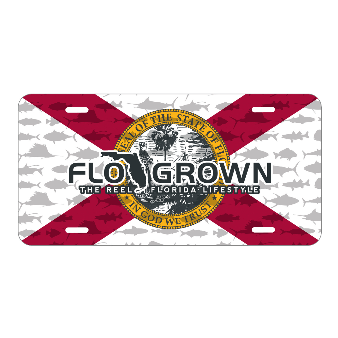 A license plate with a red, white, and black design featuring fish illustrations and the text 'FLO GROWN THE REEL FLORIDA LIFESTYLE' over the Florida flag.