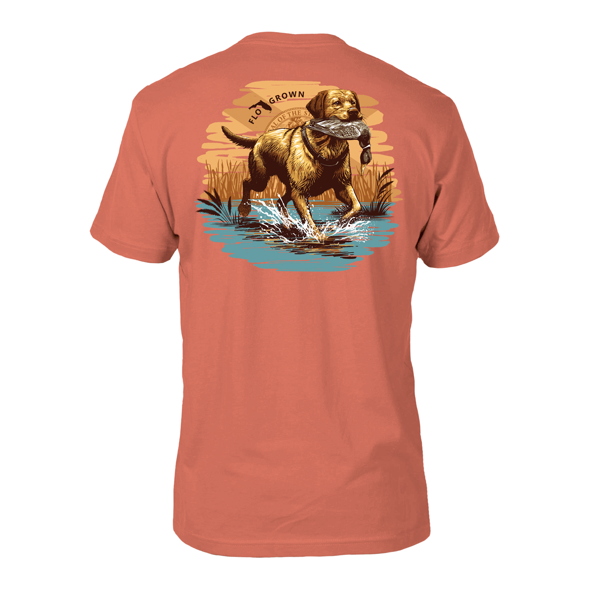 Coral colored shirt with a graphic of a dog running back with a duck at sunrise on the back.