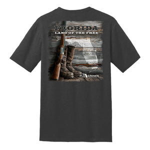 Gray t-shirt with a graphic of boots, rifle, and 'Florida Land of the Free' text on the back.