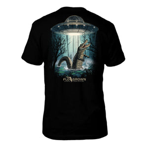 Black t-shirt with a graphic of an alligator being abducted by a UFO, brand 'FLO GROWN' visible.