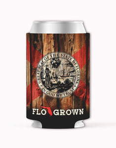 Can cooler with Florida state seal and 'FLO GROWN' text on a wooden background.