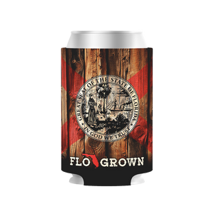 Can cooler with Florida state seal and 'FLO GROWN' text on a wooden background.