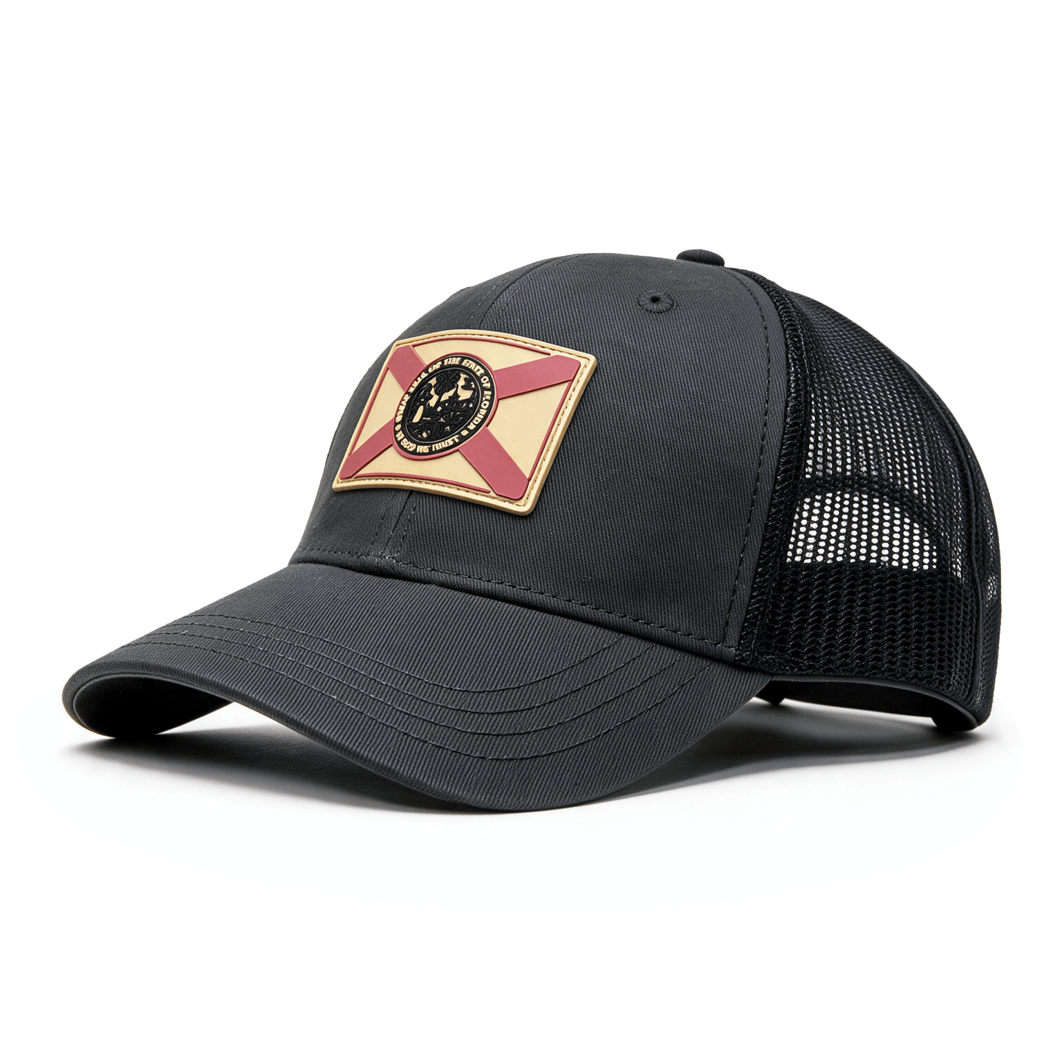 A black trucker-style baseball cap with a curved brim, black mesh back panels, and a front patch featuring the Florida state flag design.