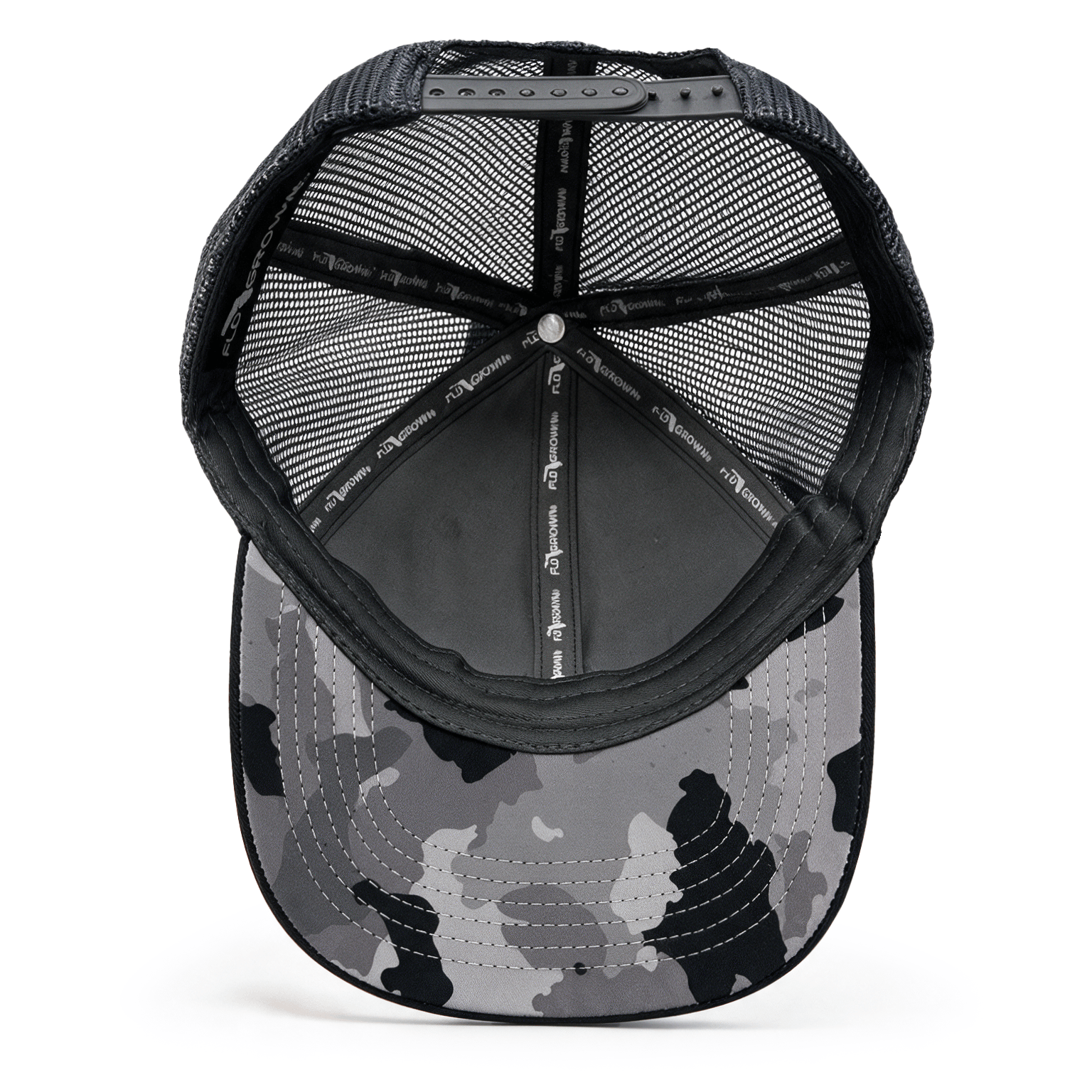 The underside of a black and gray camouflage trucker cap, showing the mesh back, and interior padding.