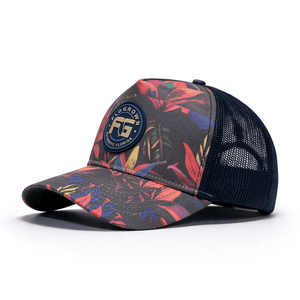 Trucker hat with colorful leaf pattern and rubber FloGrown logo patch on the crown.