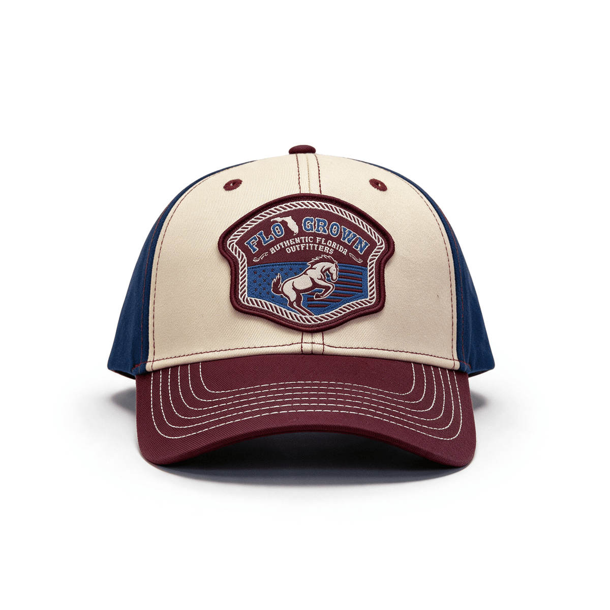 Full front view showing the crown with patch and red brim.