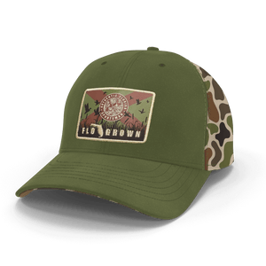 Green cap with a camouflage backing and patch of the Florida flag on the crown.