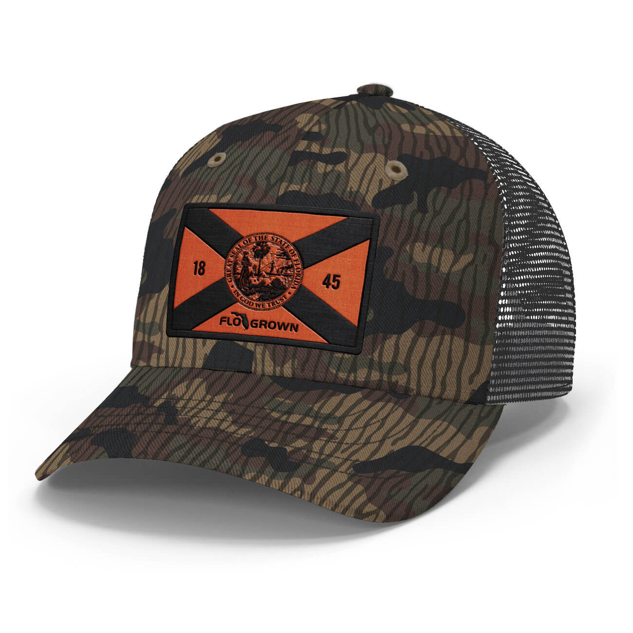 A camouflage trucker hat with a black mesh back and a front patch featuring an orange and black Florida flag with the text 'FLOGROWN'.