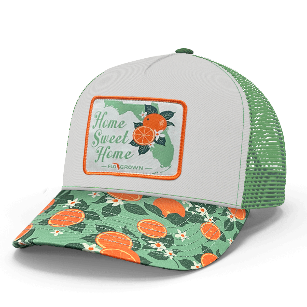 Trucker hat with floral and orange design on the visor with a white crown and a patch that says 