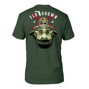 Green tee with a graphic of a gator in the water and the Florida flag behind it.