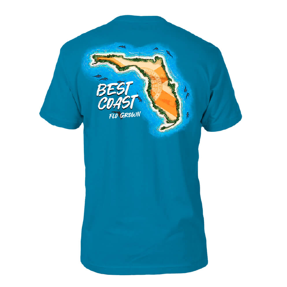 The shape of Florida depicted as an island with the Florida flag within it, surrounded by sharks on the back of a blue tee.