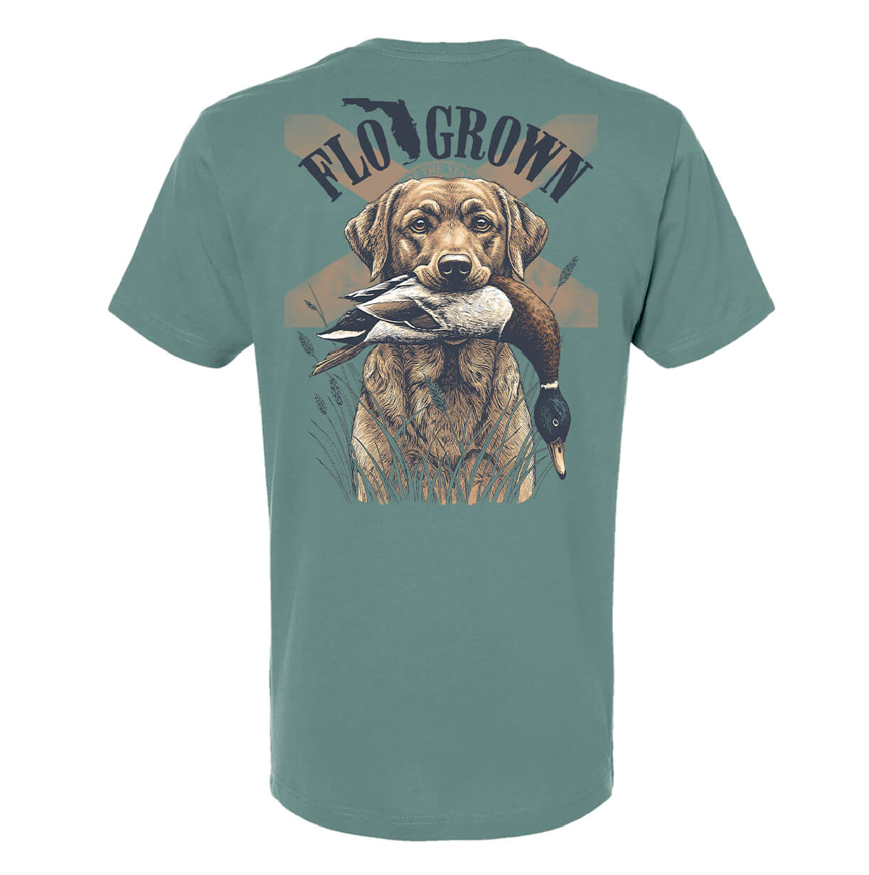 A basil colored tee with a graphic of a dog with a duck in its mouth and the Florida flag behind it with text 'FLOGROWN' on the top in an arch.