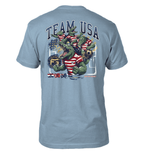 Light blue t-shirt with 'Team USA' graphic featuring a gator in a USA uniform in different poses.