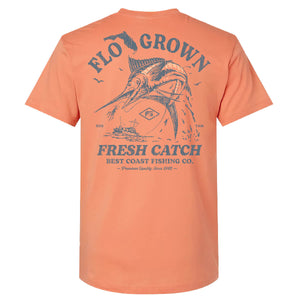 Peach-colored t-shirt with fishing graphic of a marlin.