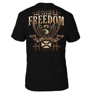 Black t-shirt with an eagle graphic and text 'THE STATE OF FREEDOM' on the back.