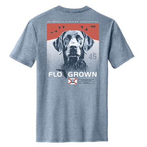 Gray shirt with a graphic of a dog with geese flying over it and the FloGrown logo underneath.