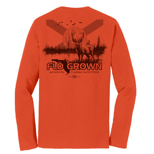 Orange long sleeve with a graphic of a deer in front of a lake and forest with the Florida flag on the horizon. 