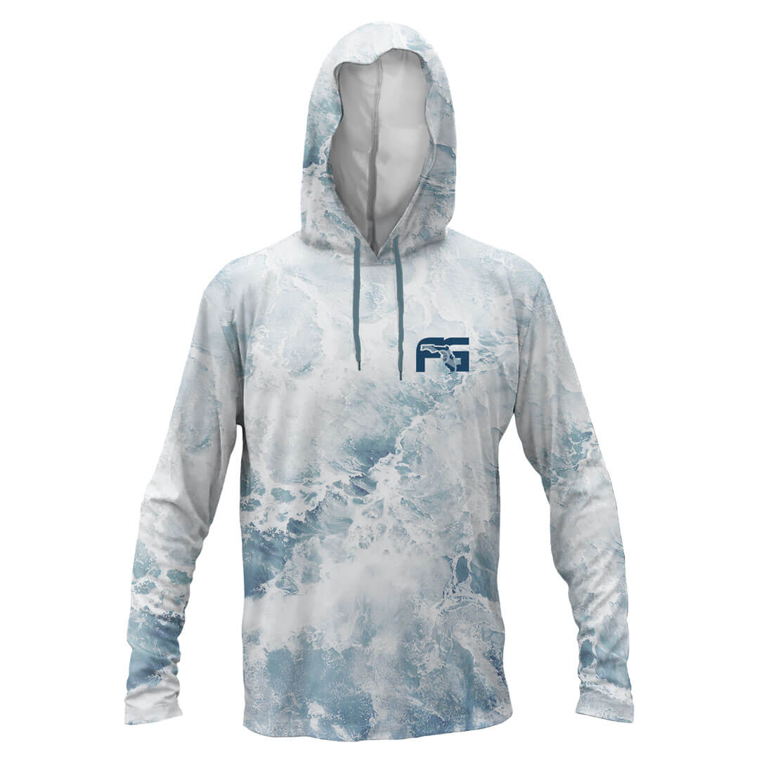 A long-sleeve hooded shirt with an all-over ocean wave print in shades of light blue, white, and gray. It features a dark blue 'FS' logo on the left chest and matching blue drawstrings, displayed on a clean white background.