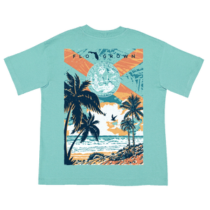 Teal womens tee with a graphic of a beach sunset and the Florida flag.