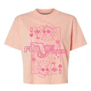 Peach colored womens tee with a graphic of a playing card of the queen of hearts as a woman on a beach.