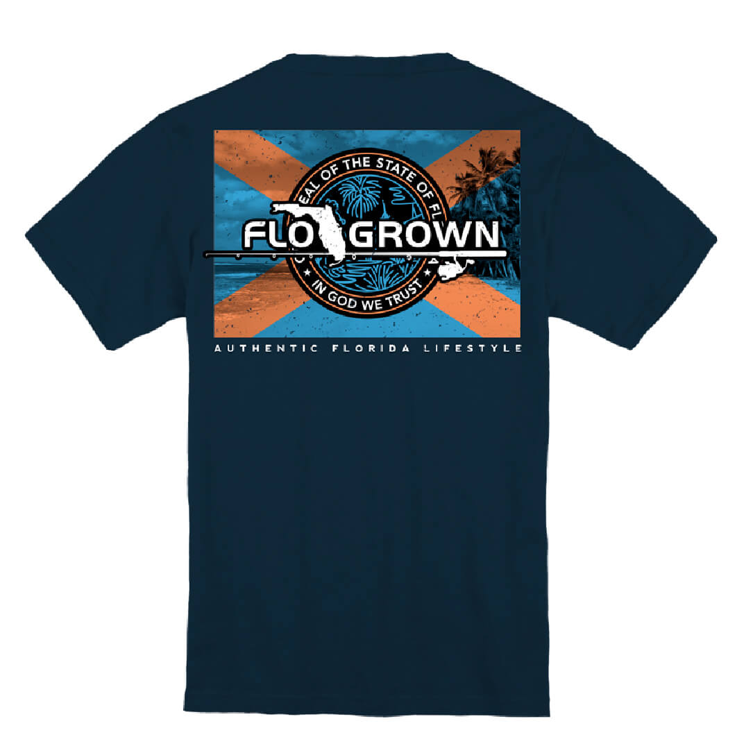 Navy tee with a graphic on the back of a beach scene with the Florida flag in the center and the FloGrown logo.