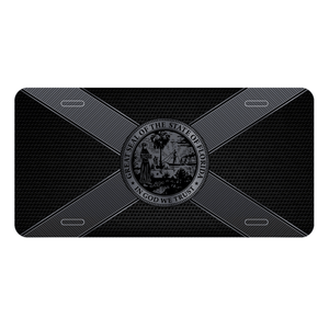 A black metal license plate with the Florida flag in black and silver.
