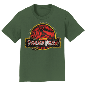 Green graphic tee with a yellow circle and a red background within with a gator skeleton and the text 'REDNECK SWAMP PARK'.