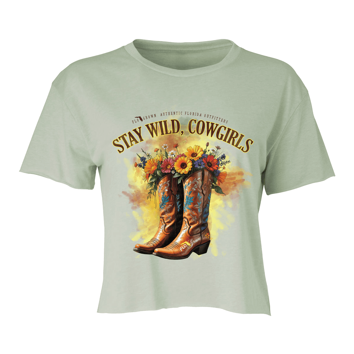 Green crop top with a graphic of cowboy boots with flowers in them and the text 'STAY WILD, COWGIRLS'.