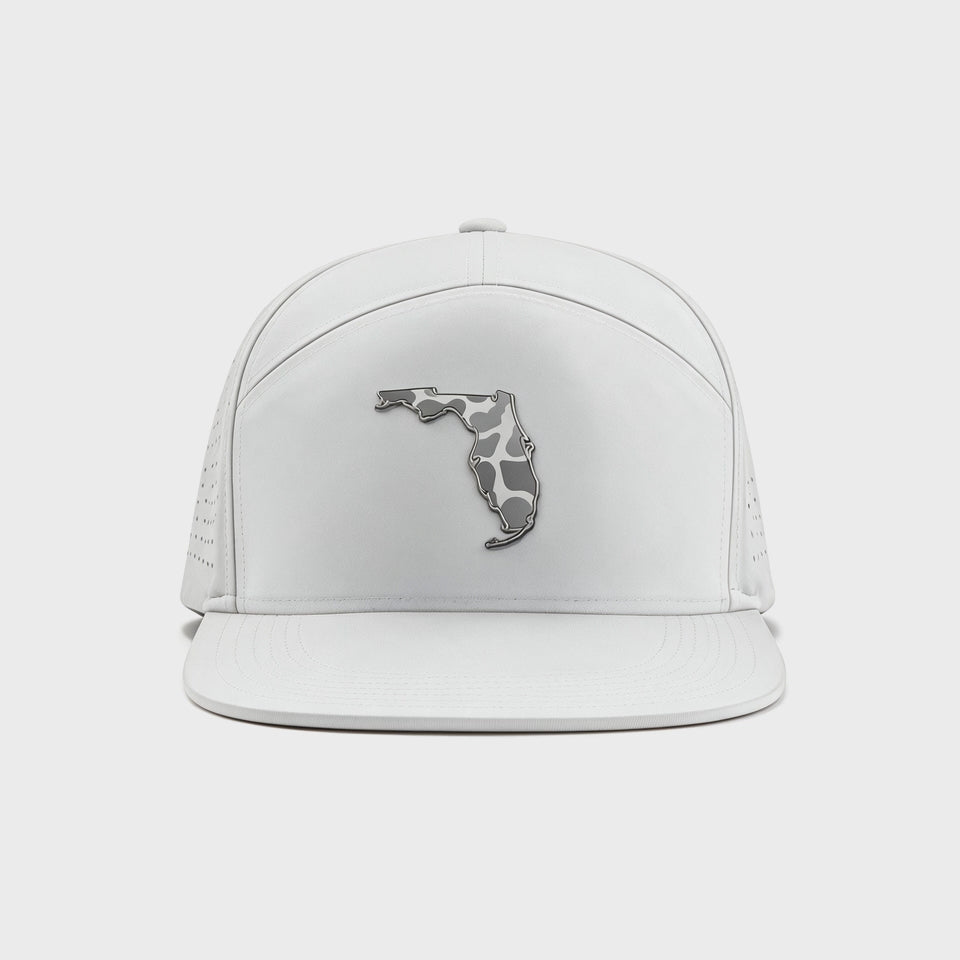 White hat with a state of Florida badge with gray and white camo within it. Perforated white backing.