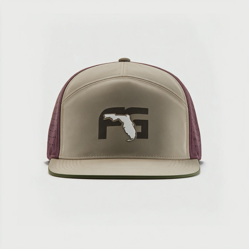 Video showing 180 degree view of the flat brim hat with tan front and FG logo on the crown and red perforated backing.