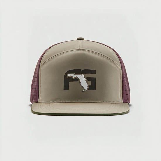 Video showing 180 degree view of the flat brim hat with tan front and FG logo on the crown and red perforated backing.
