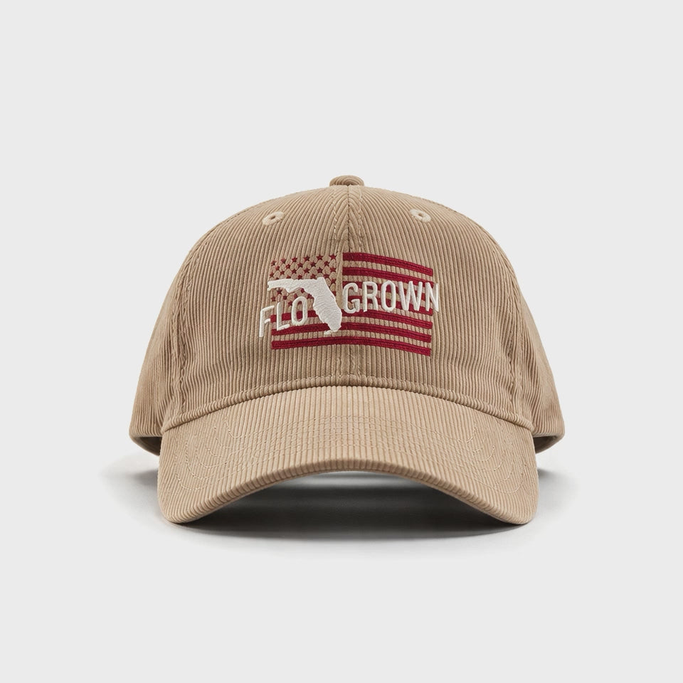 Video showing a 180 view of the tan hat with an embroidered American flag on the front and FloGrown logo. 