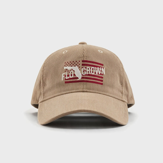 Video showing a 180 view of the tan hat with an embroidered American flag on the front and FloGrown logo. 