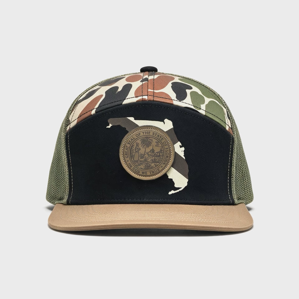 180 degree video of a hat with a black crown and outline of Florida with a patch of the Florida seal.