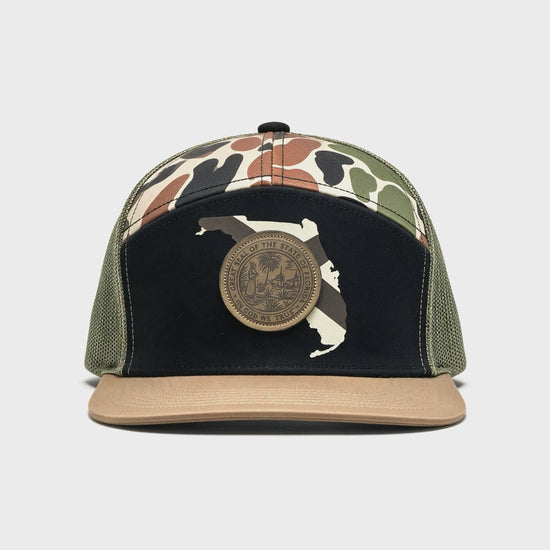 180 degree video of a hat with a black crown and outline of Florida with a patch of the Florida seal.